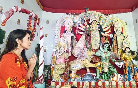 Barsha Rani Bishaya offering prayer on Saptami