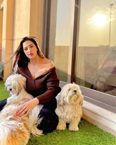 natasha assadi with her pet dogs