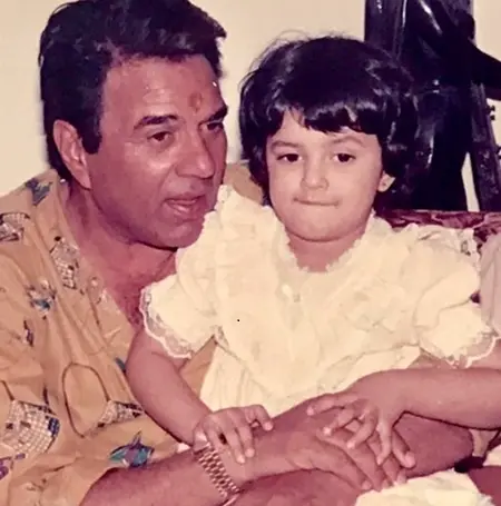 Childhood picture of Prerna Gill with grandfather Dharmendra